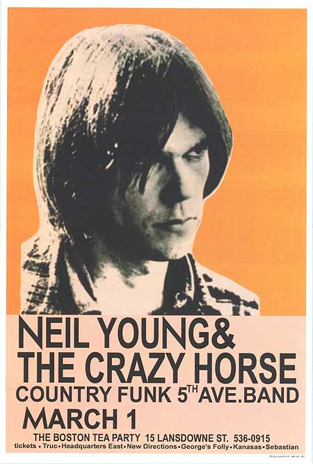 Neil Young performing live at a concert, showcasing his iconic style.