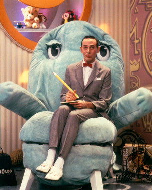 Pee Wee's Playhouse collectibles displayed on a shelf, showcasing vintage toys and memorabilia
