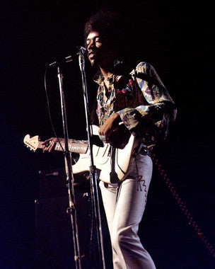 Vibrant Jimi Hendrix concert poster showcasing live performance energy.