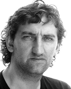 Jimmy Nail singing on stage at a country music festival