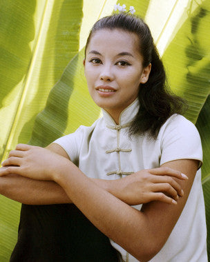 Close-up of France Nuyen’s South Pacific-inspired bracelet featuring hand-carved accents and coastal tones