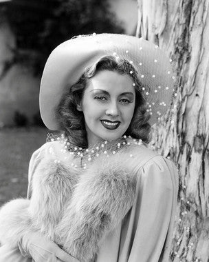 Joan Blondell signed photo showcasing her iconic smile, perfect for collectors.