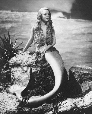 Glynis Johns in a classic film scene showcasing her talent and charm.