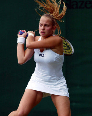 Front view of Jelena Dokic athletic apparel on a tennis player in action.
