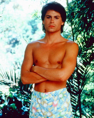 Rob Lowe signed memorabilia displayed on a shelf, perfect for collectors