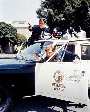 Cover of Adam-12 DVD box set showcasing iconic characters.