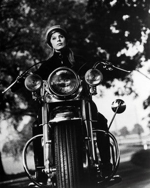 Alain Delon riding a vintage motorcycle in Girl on a Motorcycle film scene