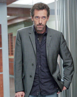 Hugh Laurie autographed poster displayed in a fan's collection.