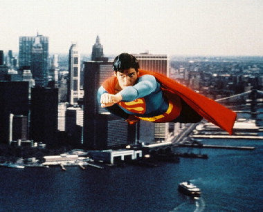 Front view of Christopher Reeve Superman figure, showcasing authentic details.