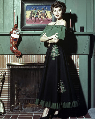 Barbara Stanwyck in a classic Hollywood film scene, showcasing her iconic style