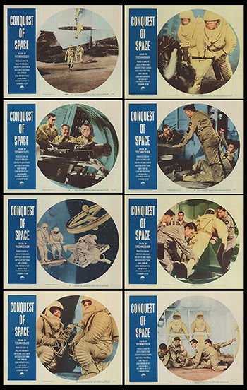 Close-up of the space-themed game pieces on a table, showing detailed design and colors.